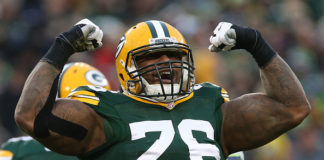 Mike Daniel of the Green Bay Packers celebrates after making a tackle