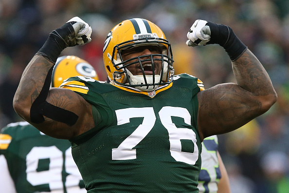 Mike Daniel of the Green Bay Packers celebrates after making a tackle