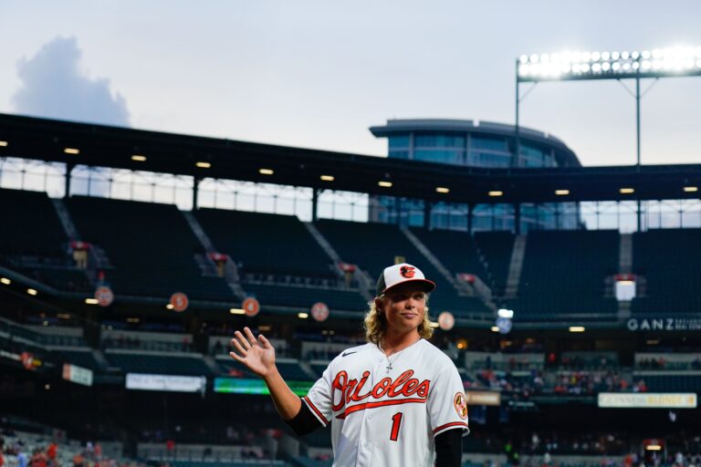 Jul 27, 2022; Baltimore, Maryland, USA; Baltimore Orioles number one draft pick Jackson Holliday waves to the crowd while being introduced during third inning of the game against the Tampa Bay Rays at Oriole Park at Camden Yards. Mandatory Credit: Tommy Gilligan-USA TODAY Sports