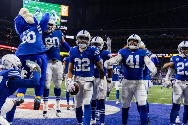 Dec 16, 2023; Indianapolis, Indiana, USA; Indianapolis Colts safety Julian Blackmon (32) celebrates his interception with teammates in the second half against the Pittsburgh Steelers at Lucas Oil Stadium. Mandatory Credit: Trevor Ruszkowski-USA TODAY Sports