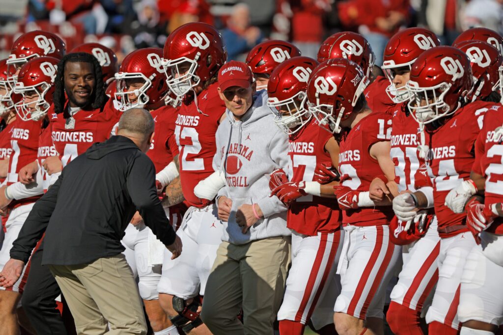Oklahoma Sooner Head Coach Brent Venables leads the Oklahoma Sooners football team out on to the field.