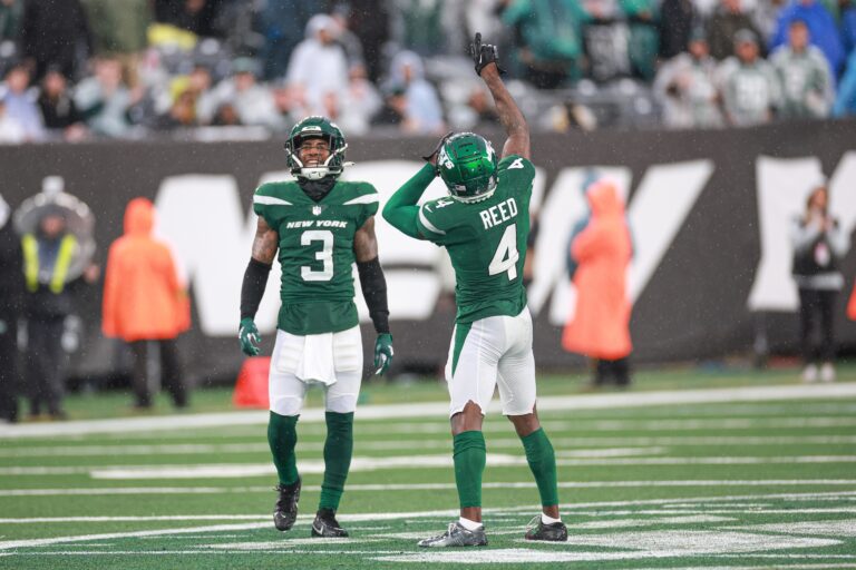 D.J. Reed (4) and Jordan Whitehead (3) in the green jerseys celebrate a defensive stop in their win against the Houston Texans.