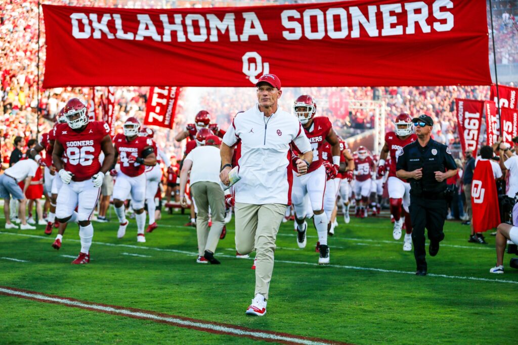 Brent Venables runs on the field before an NCAA football game between University of Oklahoma (OU) and Iowa State at the Gaylord Family Oklahoma Memorial Stadium in Norman, Okla., on Saturday, Sept. 30, 2023.