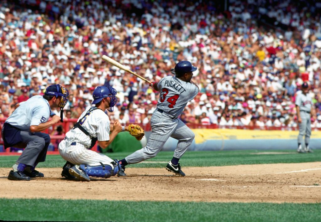 Kirby Puckett (34) for the Twins swings bat in a critical moment against the Milwaukee Brewers in Milwaukee Country Stadium in 1992.