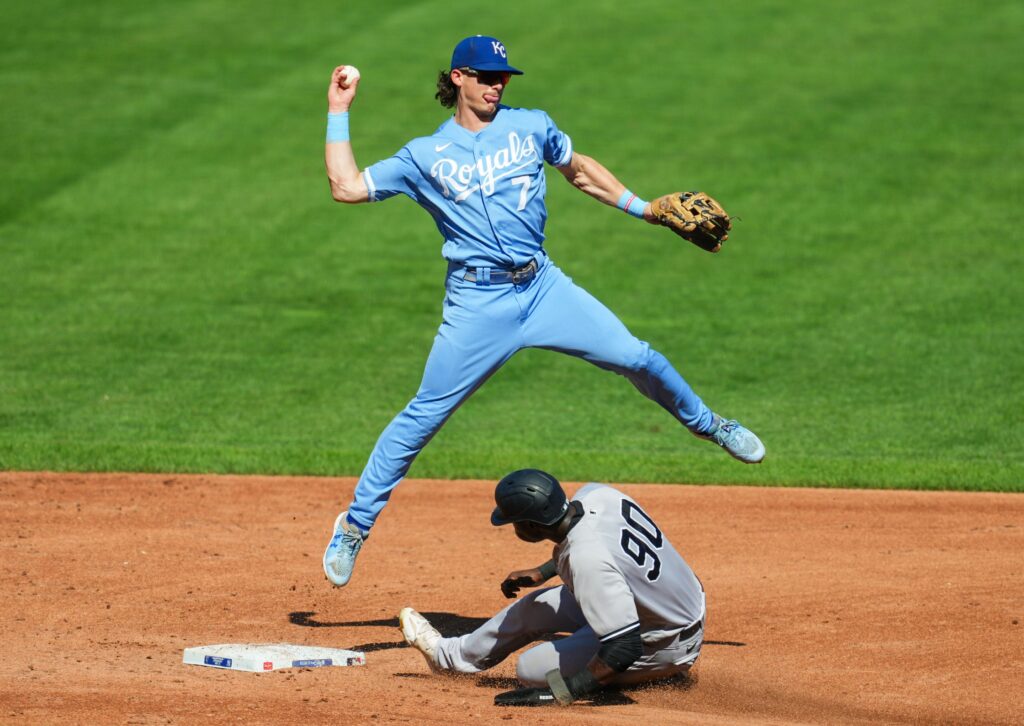 Kansas City Royals shortstop Bobby Witt Jr. (7) throws to first base after forcing out New York Yankees center fielder Estevan Florial (90) during the third inning at Kauffman Stadium.