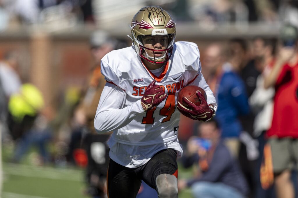 Florida State Seminole wide receiver Johnny Wilson (14) runs with the ball at the Senior Bowl in Mobile, Alabama