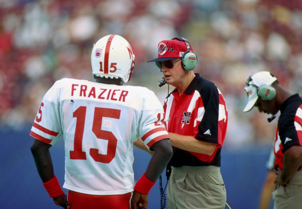 Nebraska Cornhuskers head coach Tom Osborne talks to quarterback Tommie Fraizer during the 1994 season at Giants Stadium.