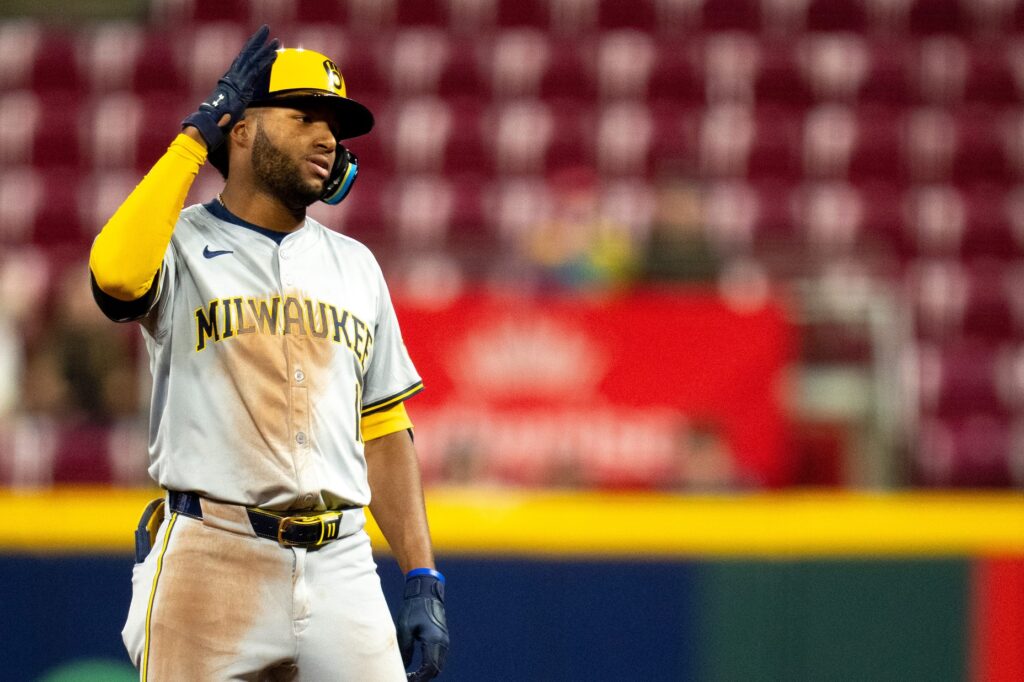 Milwaukee Brewers outfielder Jackson Chourio (11) reaches second base off of a RBI base hit against the Cincinnati Reds at Great American Ball Park in Cincinnati, Ohio on April 10, 2024.
