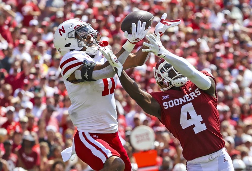 Nebraska Cornhuskers cornerback Braxton Clark (11) breaks up a pass intended for Oklahoma Sooners wide receiver Mario Williams (4) during the fourth quarter at Gaylord Family-Oklahoma Memorial Stadium.