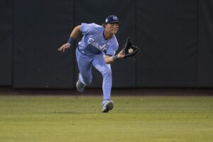 North Carolina Tar Heels outfielder Vance Honeycutt (7) makes a running catch against the Louisiana State Tigers in the eighth inning of the Div. I NCAA baseball regional at Boshamer Stadium. 