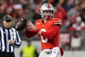 Ohio State quarterback Kyle McCord looks to pass during a game against Minnesota at Ohio Stadium in Columbus, Ohio on Nov. 18, 2023.Ohio State quarterback Kyle McCord looks to pass during a game against Minnesota at Ohio Stadium in Columbus, Ohio on Nov. 18, 2023.