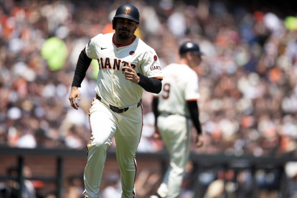 San Francisco Giants first baseman LaMonte Wade Jr. (31) scores on a single by Patrick Bailey during the third inning against the Minnesota Twins at Oracle Park.