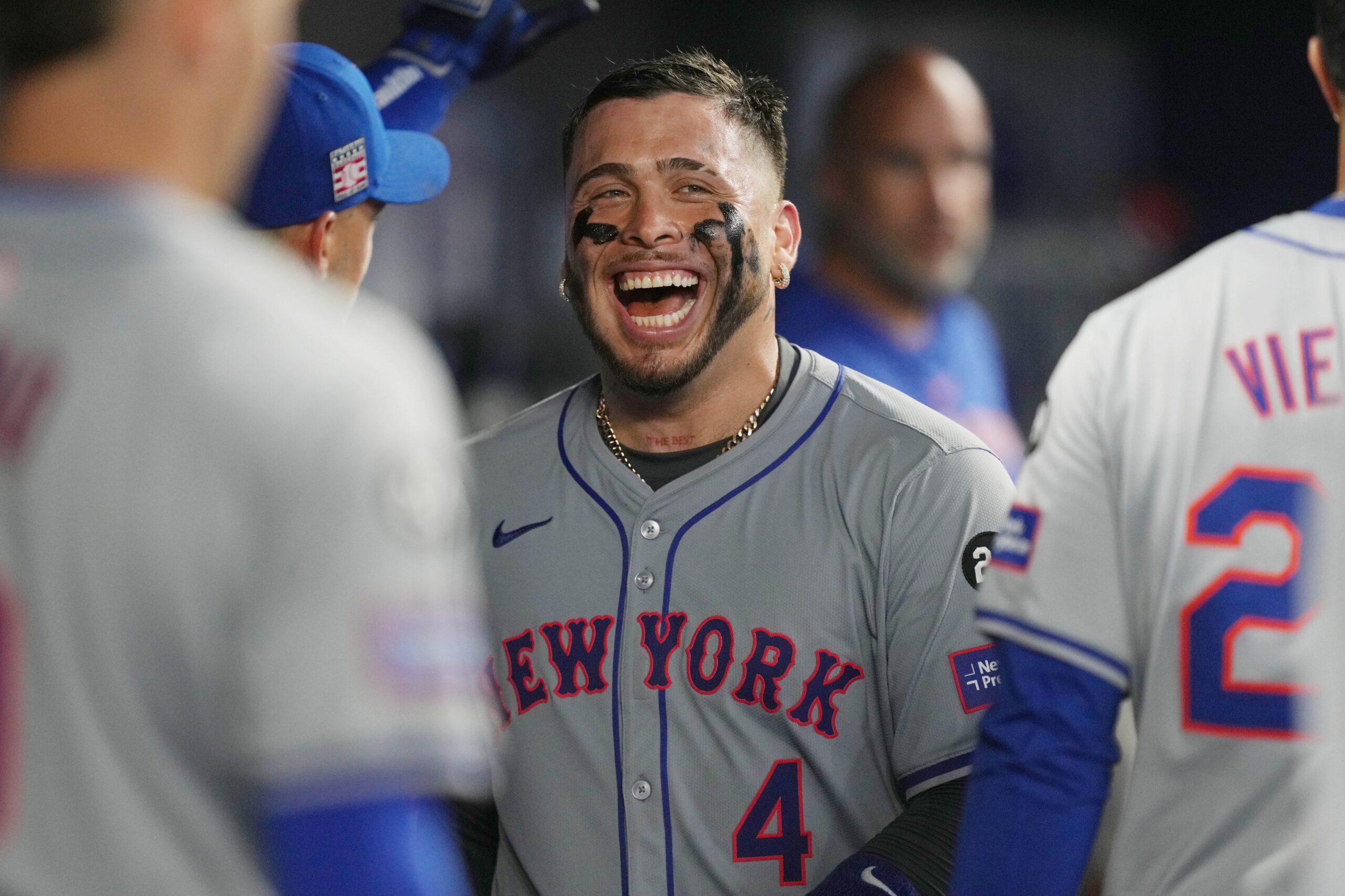 New York Mets catcher Francisco Alvarez (4) laughs in the dugout following the seventh inning against the Miami Marlins at loanDepot Park.