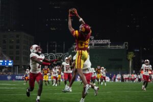 Southern California Trojans wide receiver Ja'Kobi Lane (89) catches a touchdown pass against Louisville Cardinals defensive back Jarvis Brownlee Jr. (2) and defensive back Devin Neal (27) in the second half of the Holiday Bowl at Petco Park.