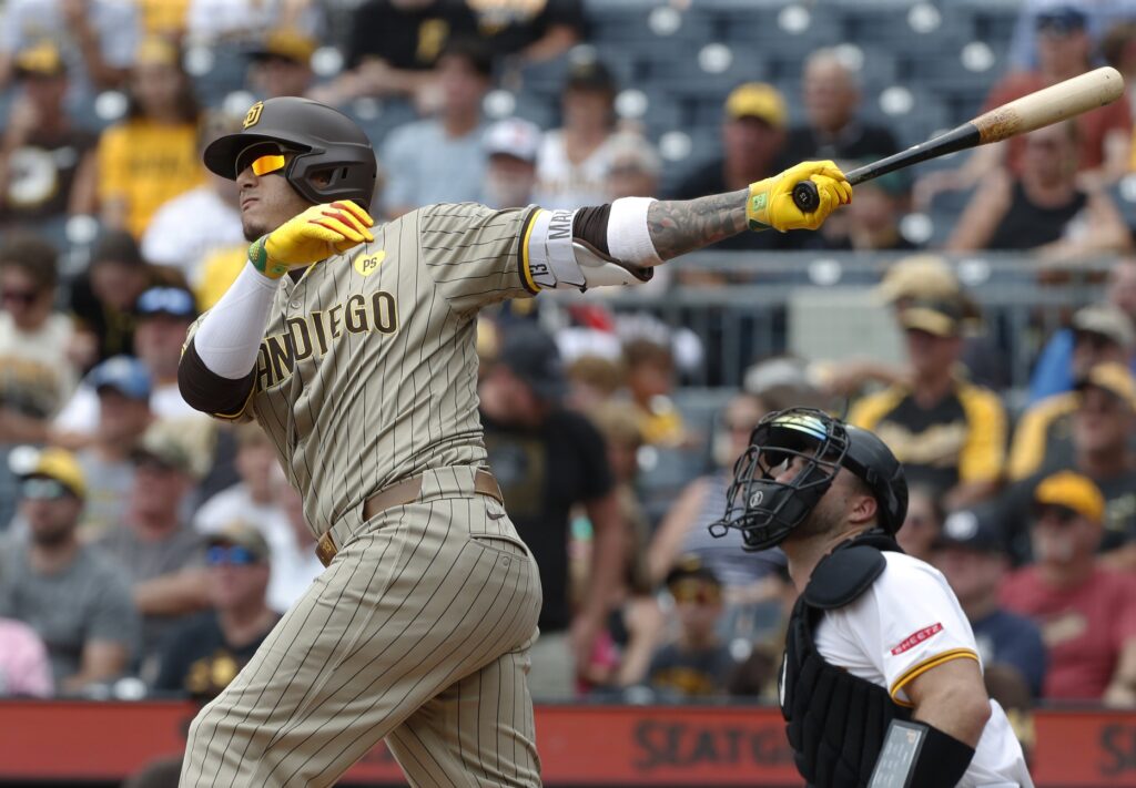 San Diego Padres third baseman Manny Machado (13) hits a two run home run against the Pittsburgh Pirates during the first inning at PNC Park.