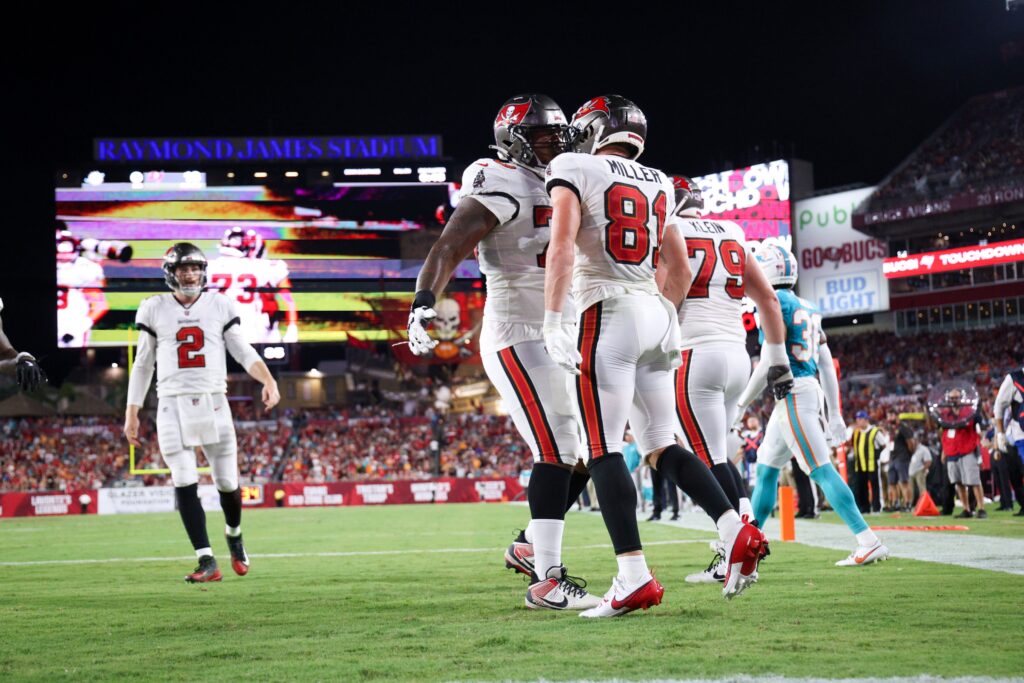 Tampa Bay Buccaneers wide receiver Ryan Miller (81) celebrates with offensive tackle Brandon Walton (73) after scoring a touchdown against the Miami Dolphins in the second quarter during preseason at Raymond James Stadium.