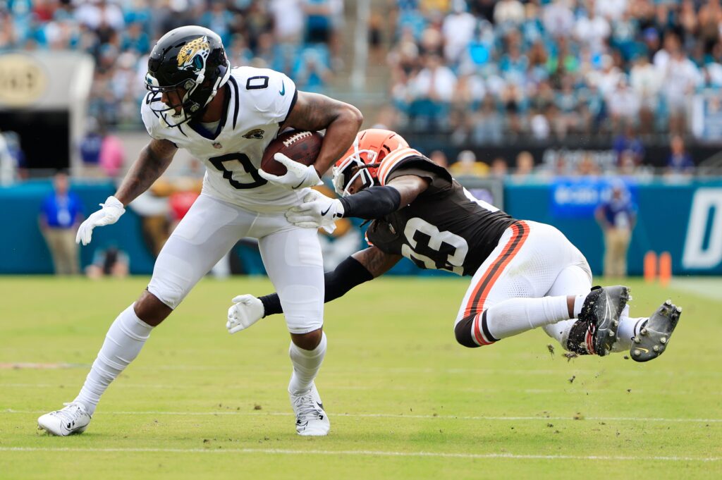 Jacksonville Jaguars wide receiver Gabe Davis (0) escapes Cleveland Browns cornerback Martin Emerson Jr. (23) during the fourth quarter of an NFL football matchup Sunday, Sept. 15, 2024 at EverBank Stadium in Jacksonville, Fla. The Browns defeated the Jaguars 18-13.