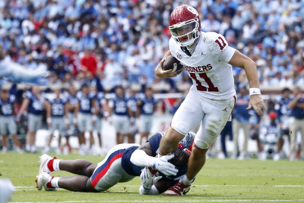 Mississippi Rebels linebacker Suntarine Perkins (4) sacks Oklahoma Sooners quarterback Jackson Arnold (11) during the first half at Vaught-Hemingway Stadium.