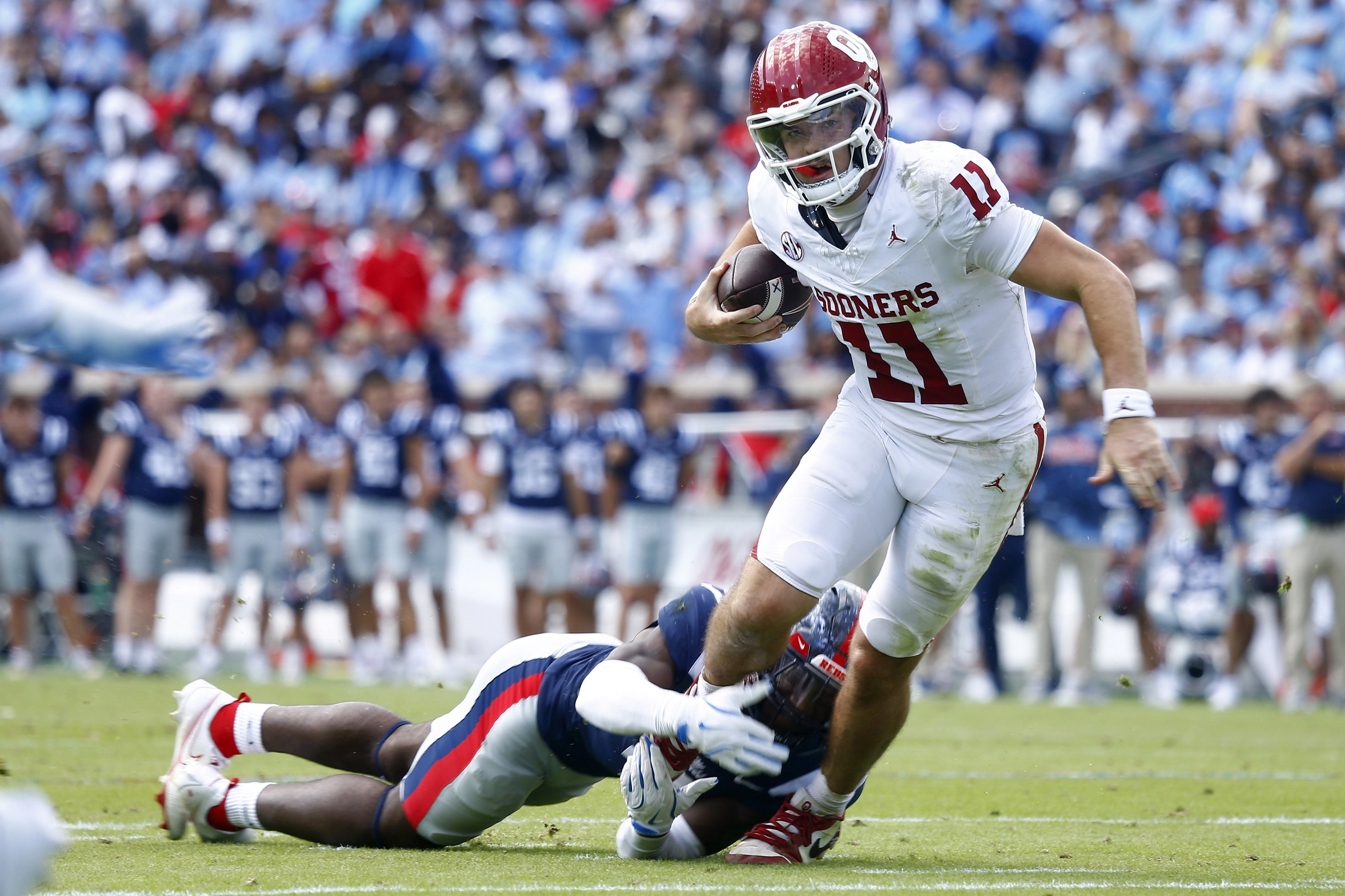 Mississippi Rebels linebacker Suntarine Perkins (4) sacks Oklahoma Sooners quarterback Jackson Arnold (11) during the first half at Vaught-Hemingway Stadium.