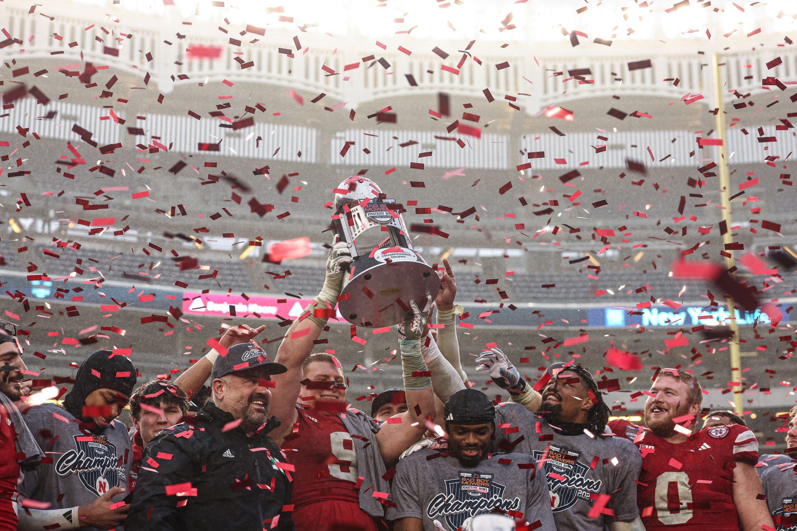 Nebraska Cornhuskers head coach Matt Rhule and players celebrate after the game against the Boston College Eagles at Yankee Stadium.