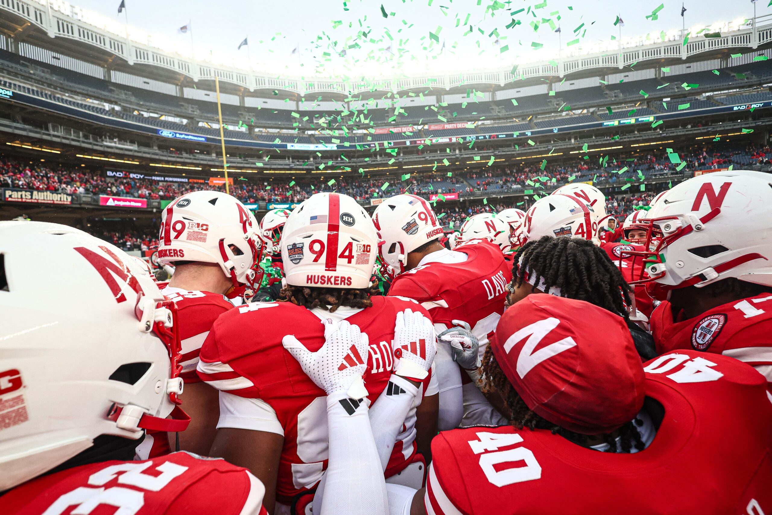 The Nebraska Cornhuskers celebrate its Pinstripe Bowl victory.